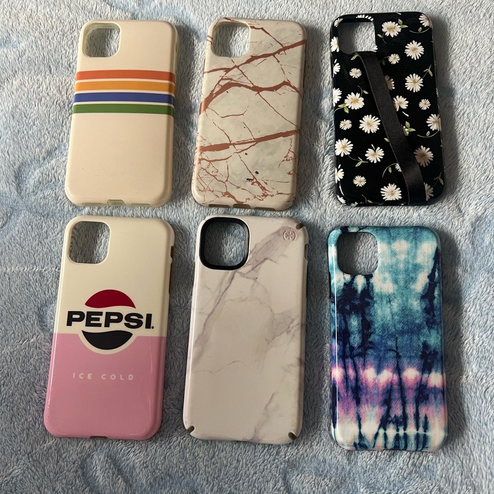 Assorted Decorative iPhone 11 Cases - Pink, White, Black, Blue Designs.